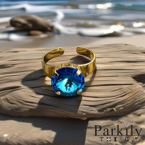 Gold Ring with Blue Crystal
